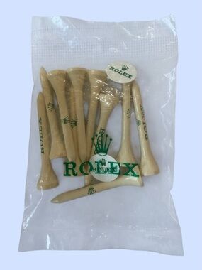 Rolex Branded Ten Golf Tees & Two Ball Markers Green Lettering Crown Logo Sealed